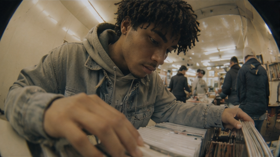 A person browses records in a shop